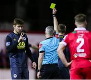 28 February 2020; Rory Feely of St Patrick's Athletic receives a yellow card from referee Sean Grant during the SSE Airtricity League Premier Division match between Shelbourne and St Patrick's Athletic at Tolka Park in Dublin. Photo by Michael P Ryan/Sportsfile