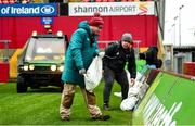 29 February 2020; Maintanence staff David Lowe and Dylan Kelly place sandbags against the advertising hoardings to combat the effects of high winds prior to the Guinness PRO14 Round 13 match between Munster and Scarlets at Thomond Park in Limerick. Photo by Diarmuid Greene/Sportsfile