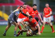 29 February 2020; Jack O'Sullivan of Munster is tackled by Uzair Cassiem of Scarlets during the Guinness PRO14 Round 13 match between Munster and Scarlets at Thomond Park in Limerick. Photo by Ramsey Cardy/Sportsfile