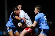 29 February 2020; Michael O'Neill of Tyrone is tackled by Niall Scully, left, and Seán Bugler of Dublin during the Allianz Football League Division 1 Round 5 match between Tyrone and Dublin at Healy Park in Omagh, Tyrone. Photo by David Fitzgerald/Sportsfile