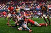 29 February 2020; Angus O'Brien of Scarlets is tackled by Chris Cloete, left, and Craig Casey of Munster during the Guinness PRO14 Round 13 match between Munster and Scarlets at Thomond Park in Limerick. Photo by Ramsey Cardy/Sportsfile