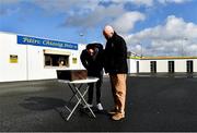 1 March 2020; Munster Council's Operations manager John Brennan and Clare PRO Michael O'Connor, right, watch a broadcast of the Dr. Harty Cup Final, on a smartphone, before the Allianz Hurling League Division 1 Group B Round 5 match between Clare and Dublin at Cusack Park in Ennis, Clare. Photo by Ray McManus/Sportsfile