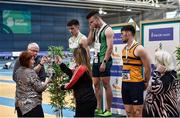 1 March 2020; An emotional Dean Adams of Ballymena and Antrim AC is presented with the Craig Lynch cup by Craig's mother Anne Lynch, left, and fiancé Amy Cotter, after winning the Senior Men's 60m event during Day Two of the Irish Life Health National Senior Indoor Athletics Championships at the National Indoor Arena in Abbotstown in Dublin. Photo by Sam Barnes/Sportsfile