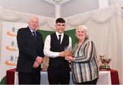 2 March 2020; Karlis Kaugars of Dunleer AC, Louth, is presented his Star Award trophy by Chairperson of the Athletics Ireland Juvenile Committee John McGrath and President of Athletics Ireland Georgina Drumm during the Juvenile Star Awards 2019 at The Bridge Hotel in Tullamore, Offaly. Photo by Harry Murphy/Sportsfile