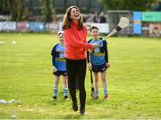 5 March 2020; Catherine, Duchess of Cambridge reacts after making an attempt to hit a sliothar with a hurley during an engagement at Salthill Knocknacarra GAA Club in Galway during day three of her visit to Ireland. Photo by Sam Barnes/Sportsfile