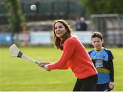 5 March 2020; Catherine, Duchess of Cambridge makes an attempt to hit a sliothar with a hurley during an engagement at Salthill Knocknacarra GAA Club in Galway during day three of her visit to Ireland. Photo by Sam Barnes/Sportsfile