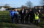 6 March 2020; FAI Interim Deputy Chief Executive Niall Quinn accompanied by Lord Mayor of Dublin Tom Brabazon and Jimmy Mowlds, FAI Development Officer, make their way to the opening of the new Darndale FC all-weather pitch at Darndale Park in Dublin. Photo by Stephen McCarthy/Sportsfile