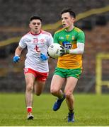 7 March 2020; Aaron Doherty of Donegal in action against Tomas Donaghy of Tyrone during the EirGrid Ulster GAA Football U20 Championship Final match between Tyrone and Donegal at St Tiernach's Park in Clones, Monaghan. Photo by Oliver McVeigh/Sportsfile