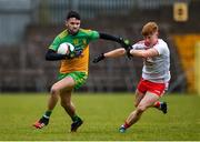 7 March 2020; Keelan McGroddy of Donegal in action against James McCann of Tyrone during the EirGrid Ulster GAA Football U20 Championship Final match between Tyrone and Donegal at St Tiernach's Park in Clones, Monaghan. Photo by Oliver McVeigh/Sportsfile