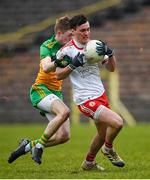 7 March 2020; Darragh Canavan of Tyrone in action against Oisin Walsh of Donegal during the EirGrid Ulster GAA Football U20 Championship Final match between Tyrone and Donegal at St Tiernach's Park in Clones, Monaghan. Photo by Oliver McVeigh/Sportsfile