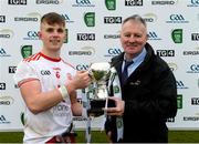 7 March 2020; Tyrone captain Antoin Fox receives the cup from Fergal Keenan, EirGrid agricultural liason officer, following the EirGrid Ulster GAA Football U20 Championship Final match between Tyrone and Donegal at St Tiernach's Park in Clones, Monaghan. Photo by Oliver McVeigh/Sportsfile