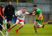 7 March 2020; Neil Kilpatrick of Tyrone in action against Eric Carr of Donegal during the EirGrid Ulster GAA Football U20 Championship Final match between Tyrone and Donegal at St Tiernach's Park in Clones, Monaghan. Photo by Oliver McVeigh/Sportsfile
