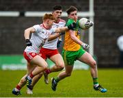 7 March 2020; Cormac Finn of Donegal in action against James McCann and Joe Ogus of Tyrone during the EirGrid Ulster GAA Football U20 Championship Final match between Tyrone and Donegal at St Tiernach's Park in Clones, Monaghan. Photo by Oliver McVeigh/Sportsfile