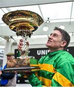 10 March 2020; Jockey Barry Geraghty celebrates with the cup after winning the Unibet Champion Hurdle Challenge Trophy on Epatante on Day One of the Cheltenham Racing Festival at Prestbury Park in Cheltenham, England. Photo by David Fitzgerald/Sportsfile