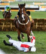 13 March 2020; Jockey Jamie Moore falls from Goshen after jumping the last during the JCB Triumph Hurdle on Day Four of the Cheltenham Racing Festival at Prestbury Park in Cheltenham, England. Photo by Harry Murphy/Sportsfile