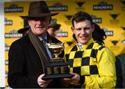 13 March 2020; Jockey Paul Townend, right, and trainer Willie Mullins with the cup after winning the Magners Cheltenham Gold Cup Chase with Al Boum Photo during Day Four of the Cheltenham Racing Festival at Prestbury Park in Cheltenham, England. Photo by Harry Murphy/Sportsfile