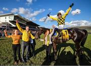 13 March 2020; Paul Townend on Al Boum Photo, celebrates with Stable Hand Paul Roche, second from left, and winning connections after the Magners Cheltenham Gold Cup Chase on Day Four of the Cheltenham Racing Festival at Prestbury Park in Cheltenham, England. Photo by David Fitzgerald/Sportsfile