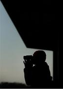 22 March 2020; An owner watches on with binoculars during the WKD Rated Hurdle at Downpatrick Racecourse in Downpatrick, Down. Photo by Ramsey Cardy/Sportsfile