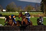 24 March 2020; Mutadaffeq, centre, with Jonathan Moore up, jumps the last alongside eventual second place Bitsandpieces, left, with Simon Torrens up, on their way to winning the Live Streaming On The BoyleSports App Beginners Steeplechase at Clonmel Racecourse in Clonmel, Tipperary. Photo by Seb Daly/Sportsfile