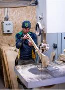 31 March 2020; Stephen Dowling shapes the hurl with a bandsaw during a feature on The Star Hurley in Jenkinstown, Kilkenny. Photo by Ramsey Cardy/Sportsfile