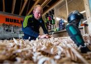 31 March 2020; David Dowling shapes the hurl with a spokeshave during a feature on The Star Hurley in Jenkinstown, Kilkenny. Photo by Ramsey Cardy/Sportsfile