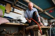 5 May 2020; Masters athlete Pat Naughton, age 87, cuts up wood following a training session at his home in Nenagh, Tipperary, during the on-going Coronavirus (COVID-19) pandemic. Photo by Stephen McCarthy/Sportsfile