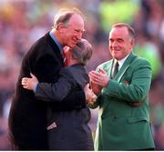 30 May 2000; Rep of Ireland equipment officer Charlie O'Leary, centre, is embraced by former Rep of Ireland manager Jack Charlton, left, after he was presented with a momento for his services to Irish Soccer as Pat Quigley, President of the Football Association of Ireland. Photo by David Maher/Sportsfile