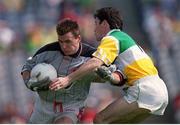 7 May 2000; Louth goalkeeper Colm Nally is tackled by Vinny Claffey of Offaly during the Church & General National Football League Division 2 Final between Louth and Offaly at Croke Park in Dublin. Photo by Ray McManus/Sportsfile