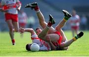 7 May 2000; Eamon Burns of Derry is tackled by Mark O'Reilly of Meath during the Church & General National Football League Final between Meath and Derry at Croke Park in Dublin. Photo by Ray McManus/Sportsfile