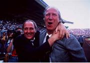 12 June 1988; Republic of Ireland Manager Jack Charlton, right, and Assistant Manager Maurice Setters celebrate their teams victory over England. European Championship Finals 1988, Group B, Republic of Ireland v England, Neckarstadion, Stuttgart, Germany. Photo by Ray McManus/Sportsfile
