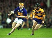 6 May 2001; Lar Corbett of Tipperary races clear from Frank Lohan of Clare during the Allianz National Hurling League Final between Tipperary and Clare at the Gaelic Grounds in Limerick. Photo by Ray McManus/Sportsfile