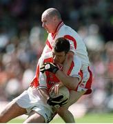 19 May 2002; Ronan Clarke, Armagh, in action against Chris Lawn, Tyrone, Tyrone v Armagh, Ulster Senior Football Championship, St. Tierneach's Park, Clones, Monaghan. Photo by Aoife Rice/Sportsfile