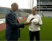19 September 2003; DJ Carey gives Jack Charlton instructions on how to hold a hurley as the three legends of Irish sport, DJ Carey, Tony Ward and Jack Charlton came together in Croke Park, Dublin, for a Flora pro.active cholesterol awareness campaign to mark World Heart Day, which is Sunday 28 September 2003. Picture credit; Ray McManus / SPORTSFILE