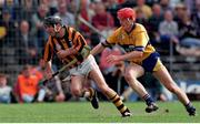 7 May 1995; DJ Carey of Kilkenny in action against Brian Lohan of Clare during the Church & General National League Hurling Final between Kilkenny and Clare at Semple Stadium in Thurles, Tipperary. Photo by Ray McManus/Sportsfile