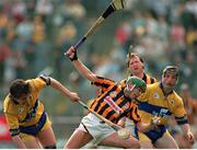 7 May 1995; Bill Hennessy of Kilkenny in action against Stephen Sheedy, left, and Jim McInerney of Clare during the Church & General National League Hurling Final between Kilkenny and Clare at Semple Stadium in Thurles, Tipperary. Photo by Ray McManus/Sportsfile