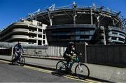 6 May 2020; Dublin GAA supporters Paul Lynch and his son Daniel, from Cabra, cycle past Croke Park stadium following a Covid-19 update by the GAA. GAA facilities are to remain closed as part of efforts to prevent gatherings which breach the current restrictions from the Department of Health and the Irish Government. Clubs and counties are to continue to adhere to the restrictions and to refrain from organising on-field activity. These measures are expected to remain in place until July 20. The GAA still hopes to be able to play county and club competitions in 2020, subject to public health guidance and have also confirmed that no inter-county games are expected to take place before October 2020. Photo by Brendan Moran/Sportsfile