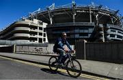 6 May 2020; Dublin GAA supporter Paul Lynch, from Cabra, cycles past Croke Park stadium following a Covid-19 update by the GAA. GAA facilities are to remain closed as part of efforts to prevent gatherings which breach the current restrictions from the Department of Health and the Irish Government. Clubs and counties are to continue to adhere to the restrictions and to refrain from organising on-field activity. These measures are expected to remain in place until July 20. The GAA still hopes to be able to play county and club competitions in 2020, subject to public health guidance and have also confirmed that no inter-county games are expected to take place before October 2020. Photo by Brendan Moran/Sportsfile