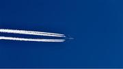 14 May 2020; The Contrails of a Magma Aviation Cargo Flight on a Boeing 747 are seen on a flight from Frankfurt in Germany to Greenville-Spartanburg International Airport in South Carolina, United States, as it passes over Dublin in the afternoon sunlight during the coronavirus (Covid-19) pandemic.  Photo by Ray McManus/Sportsfile