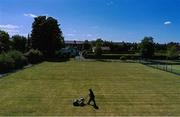 15 May 2020; A groundsman cuts the tennis lawn at Stratford Lawn Tennis Club in Rathmines, Dublin, as it prepares to re-open as one of the first sports allowed to resume having followed previous directives from the Irish Government on suspending all tennis activity in an effort to contain the spread of the Coronavirus (COVID-19). Tennis clubs in the Republic of Ireland can resume activity from May 18th under the Irish government’s Roadmap for Reopening of Society and Business once they follow the protocol published by the Tennis Ireland. The protocol sets out safe measures for tennis to return in a phased manner. Photo by Stephen McCarthy/Sportsfile