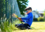 15 May 2020; Matthew Mc Glade, age 6, from Grosvenor Square, prepares the tennis lawns, under the supervision of his father Marc, a committee memeber, at Stratford Lawn Tennis Club in Rathmines, Dublin, as it prepares to re-open as one of the first sports allowed to resume having followed previous directives from the Irish Government on suspending all tennis activity in an effort to contain the spread of the Coronavirus (COVID-19). Tennis clubs in the Republic of Ireland can resume activity from May 18th under the Irish government’s Roadmap for Reopening of Society and Business once they follow the protocol published by the Tennis Ireland. The protocol sets out safe measures for tennis to return in a phased manner. Photo by Stephen McCarthy/Sportsfile