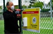 15 May 2020; Paul Foley of Digital Print and Image prepares a hand sanitising station signage at Malahide Lawn Tennis and Croquet Club in Dublin as it prepares to re-open as one of the first sports allowed to resume having followed previous directives from the Irish Government on suspending all tennis activity in an effort to contain the spread of the Coronavirus (COVID-19). Tennis clubs in the Republic of Ireland can resume activity from May 18th under the Irish government’s Roadmap for Reopening of Society and Business once they follow the protocol published by Tennis Ireland. The protocol sets out safe measures for tennis to return in a phased manner. Photo by Brendan Moran/Sportsfile