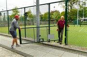 15 May 2020; Malahide Lawn Tennis and Croquet Club groundsman Eamonn O'Donnell, right, and Joey Purcell Junior remove gates on the main courts as it prepares to re-open as one of the first sports allowed to resume having followed previous directives from the Irish Government on suspending all tennis activity in an effort to contain the spread of the Coronavirus (COVID-19). Tennis clubs in the Republic of Ireland can resume activity from May 18th under the Irish government’s Roadmap for Reopening of Society and Business once they follow the protocol published by Tennis Ireland. The protocol sets out safe measures for tennis to return in a phased manner. Photo by Brendan Moran/Sportsfile