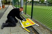 15 May 2020; Paul Foley of Digital Print and Image prepares a hand sanitising station at Malahide Lawn Tennis and Croquet Club in Dublin as it prepares to re-open as one of the first sports allowed to resume having followed previous directives from the Irish Government on suspending all tennis activity in an effort to contain the spread of the Coronavirus (COVID-19). Tennis clubs in the Republic of Ireland can resume activity from May 18th under the Irish government’s Roadmap for Reopening of Society and Business once they follow the protocol published by Tennis Ireland. The protocol sets out safe measures for tennis to return in a phased manner. Photo by Brendan Moran/Sportsfile