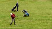 18 May 2020; Club member Brendan Foy, from Clontarf, plays a shot on the 13th fairway, watched by Paul McMahon from Raheny during a round of golf at Clontarf Golf Club in Dublin as it resumes having previously suspended all activity following directives from the Irish Government in an effort to contain the spread of the Coronavirus (COVID-19). Golf clubs in the Republic of Ireland resumed activity on May 18th under the Irish government’s Roadmap for Reopening of Society and Business following strict protocols of social distancing and hand sanitisation among others allowing it to return in a phased manner. Photo by Sam Barnes/Sportsfile