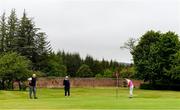 18 May 2020; Club member Siobhan McEntaggart, from Brookfield, Coollattin, putts on the 5th green, watched by Ian McEntaggart and Tom Ryan during a round of golf at Coollattin Golf Club in Wicklow as it resumes having previously suspended all activity following directives from the Irish Government in an effort to contain the spread of the Coronavirus (COVID-19). Golf clubs in the Republic of Ireland resumed activity on May 18th under the Irish government’s Roadmap for Reopening of Society and Business following strict protocols of social distancing and hand sanitisation among others allowing it to return in a phased manner. Photo by Matt Browne/Sportsfile