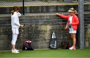 18 May 2020; Club members Bonnie Halligan, left, and Mary Flannery adhere to social distancing prior to playing a game of tennis at Malahide Lawn Tennis and Croquet Club in Dublin as tennis resumes having previously suspended all tennis activity following directives from the Irish Government in an effort to contain the spread of the Coronavirus (COVID-19). Tennis clubs in the Republic of Ireland resumed activity on May 18th under the Irish government’s Roadmap for Reopening of Society and Business following strict protocols of social distancing, hand sanitisation and marked tennis balls among others allowing tennis to return in a phased manner. Photo by Brendan Moran/Sportsfile