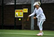 18 May 2020; A hand sanitising station is seen as club member Mary McCarthy participates in tennis at Malahide Lawn Tennis and Croquet Club in Dublin as tennis resumes having previously suspended all tennis activity following directives from the Irish Government in an effort to contain the spread of the Coronavirus (COVID-19). Tennis clubs in the Republic of Ireland resumed activity on May 18th under the Irish government’s Roadmap for Reopening of Society and Business following strict protocols of social distancing, hand sanitisation and marked tennis balls among others allowing tennis to return in a phased manner. Photo by Brendan Moran/Sportsfile