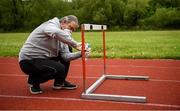 18 May 2020; Donore Harriers coach Paul Clarkin sanitises a hurdle at Donore Harriers Athletic Club in Dublin as athletics resumes having previously suspended all activity following directives from the Irish Government in an effort to contain the spread of the Coronavirus (COVID-19). Athletics clubs in the Republic of Ireland resumed activity on May 18th under the Irish government’s Roadmap for Reopening of Society and Business following strict protocols of social distancing and hand sanitisation among others allowing it to return in a phased manner. Photo by Harry Murphy/Sportsfile