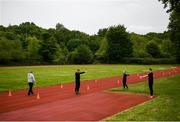 18 May 2020; Club members Alex Clarkin, Aoife Lynch and Jack Raftery participate in a training session as coach Paul Clarkin looks on at Donore Harriers Athletic Club in Dublin as athletics resumes having previously suspended all activity following directives from the Irish Government in an effort to contain the spread of the Coronavirus (COVID-19). Athletics clubs in the Republic of Ireland resumed activity on May 18th under the Irish government’s Roadmap for Reopening of Society and Business following strict protocols of social distancing and hand sanitisation among others allowing it to return in a phased manner. Photo by Harry Murphy/Sportsfile
