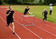 18 May 2020; Club members Jack Raftery, Alex Clarkin and Aoife Lynch participate in a training session as coach Paul Clarki looks on at Donore Harriers Athletic Club in Dublin as athletics resumes having previously suspended all activity following directives from the Irish Government in an effort to contain the spread of the Coronavirus (COVID-19). Athletics clubs in the Republic of Ireland resumed activity on May 18th under the Irish government’s Roadmap for Reopening of Society and Business following strict protocols of social distancing and hand sanitisation among others allowing it to return in a phased manner. Photo by Harry Murphy/Sportsfile